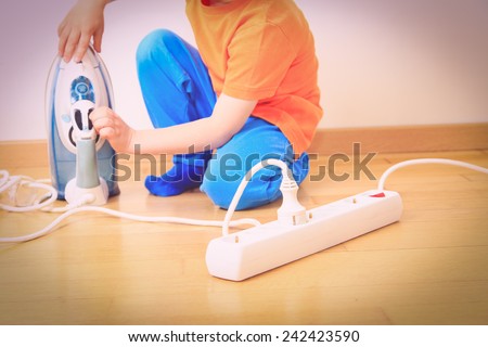 child playing with electricity, kids safety concept