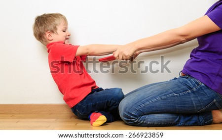 computer addiction, mother taking out touch pad from child