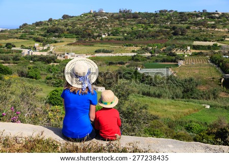 mother and son looking at scenic country views in Malta, Europe