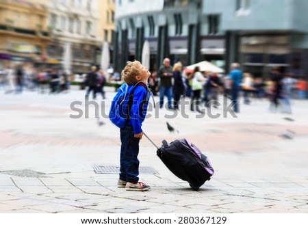 happy little boy travel in Europe, kids travel