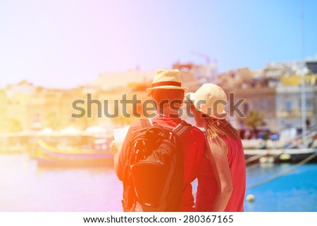tourist couple looking at map while travel in Malta, Europe