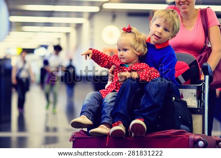 family with two kids travel in the airport, family travel