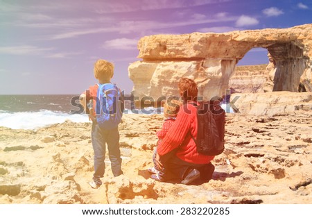 father and kids looking at Azure Window on Gozo island, family travel
