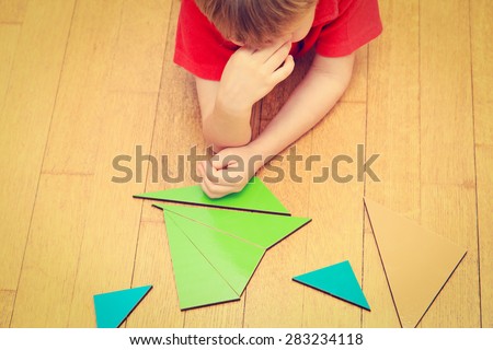 Brainstorm. Thoughts. Little boy solving math problem, thinking hard