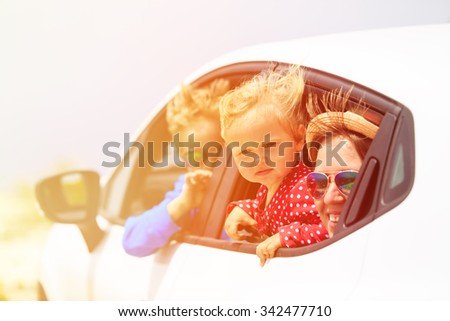 mother with son and daughter travel by car, family travel