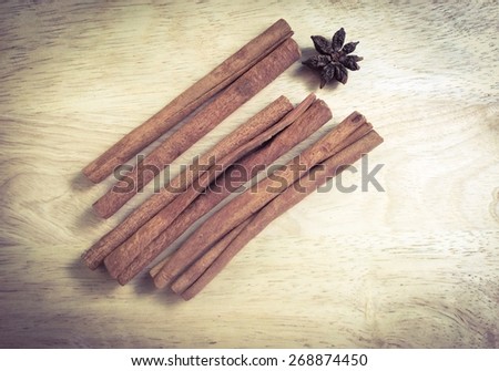 Cinnamon sticks on wooden board , vintage soft lighting filter effect