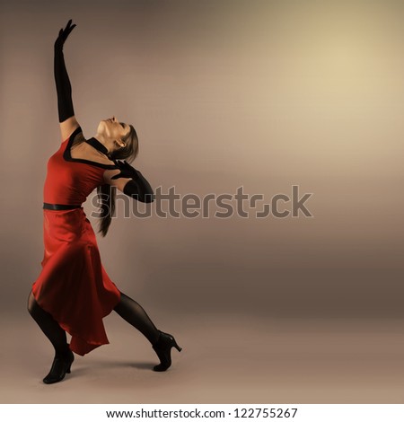 Traditional Woman Spanish Flamenco Dancer In Red Dress