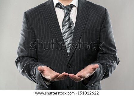 Close-up of businessman open hands giving something. Young director or manager ready to help.