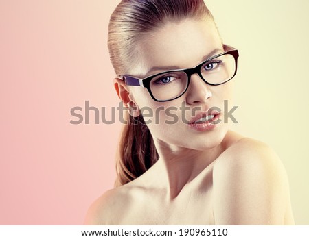 Portrait of young pretty female wearing stylish optical eyeglasses Beautiful Caucasian woman model in spectacles posing in studio Portrait of young pretty female wearing stylish optical eyeglasses Beautiful Caucasian woman model in spectacles posing in studio