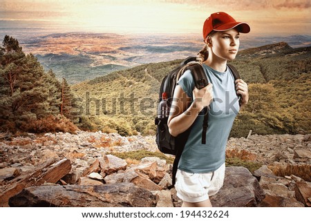 Young woman climber wearing cap with backpack hiking in mountain and hills Satisfied female traveler in sportswear trekking on sunset Young woman climber wearing cap with backpack hiking in mountain and hills Satisfied female traveler in sportswear trekking on sunset