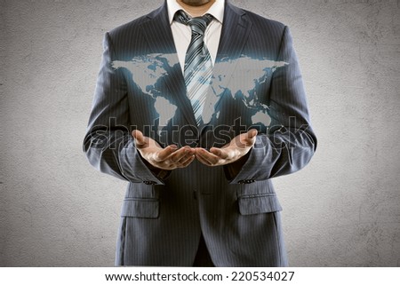 Portrait of young businessman holding world map. International business, export sales increase and start up concept.