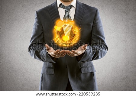 Business man holding fire balloon. Financial risk and crisis concept. Idea of overcoming economic difficulties in competitive world.