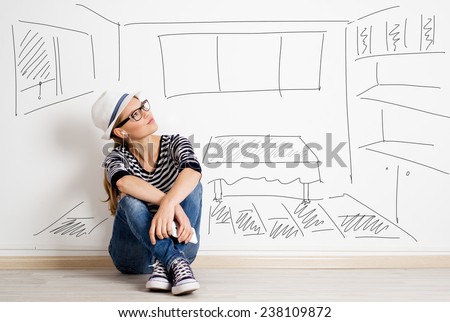 Dreaming woman in headset over drawn living room background. Young pretty female thinking of furnishing her new apartment.