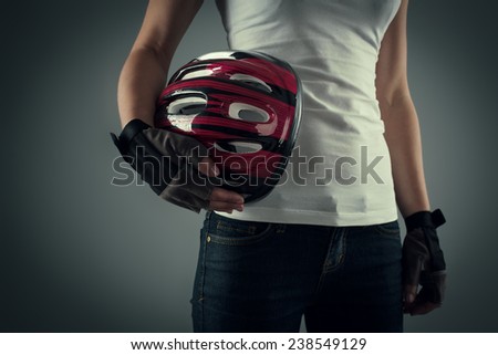 Portrait of cycling woman holding biking protective helmet ready for workout.