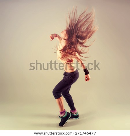 Studio shoot of active female funk jazz dancer moving. Sport and leisure concept.