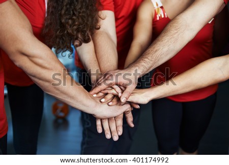 Close-up of sport team stacking hands. Concept of fitness community, partnership and cooperation.