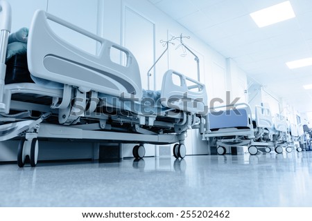 long corridor in hospital with surgical beds. tinted picture