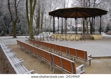 Empty seats at a concert area in a park in winter