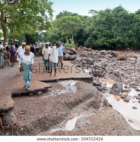 MANYARA, TANZANIA - NOVEMBER 28: The catastrophic debris flow destroyed a road between national parks Manyara and Ngorongoro. Car traffic was restored on the same day, on November 28, 2011 in Manyara, Tanzania