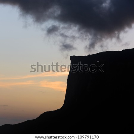 The silhouette of the cliffs of Kukenan tepui in sunset - Venezuela, South America
