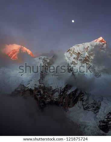 The Moon, Mt. Everest (8848 m), and Nuptse (7864 m) at sunset (view from Kala Patthar) - Nepal, Himalayas