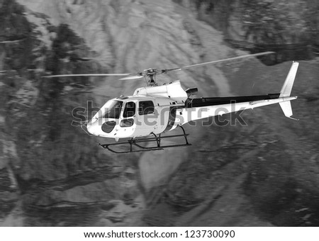 Rescue helicopter above the Everest Base Camp - Nepal, Himalayas (black and white)