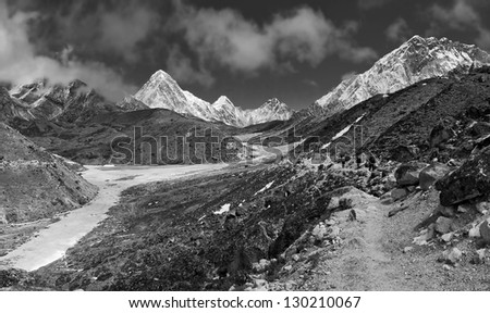 the tourists are on the trail to Everest - Nepal (black and white)