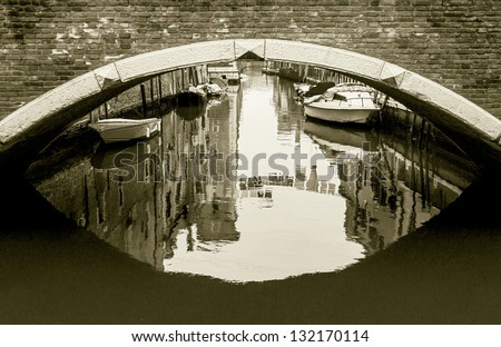 The bridge across the venetian canal in the bad weather - Venice, Italy (stylized retro)