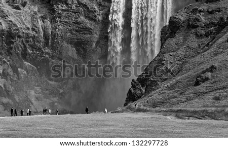 Skogafoss waterfall and rainbow in Iceland (black and white)