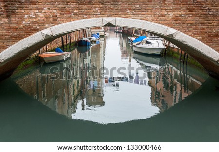 The bridge across the venetian canal in the bad weather - Venice, Italy