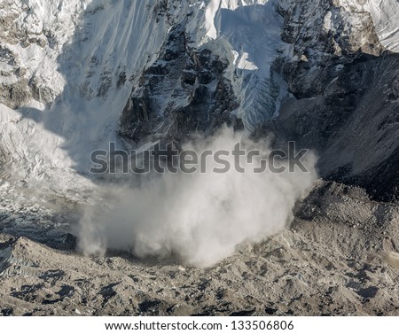 Snow avalanche falls from the slope of the Nuptse (7864 m), view from Kala Patthar - Nepal, Himalayas