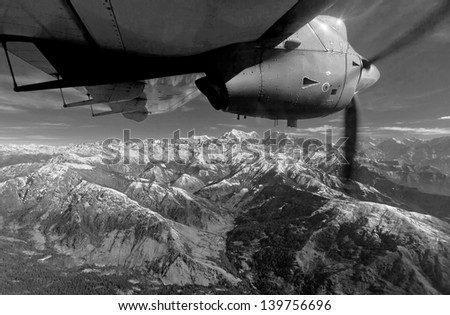The Himalayas under the wing of the airplane (black and white)