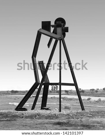 BEER SHEVA, ISRAEL - AUGUST 27: Metal photographer with a tripod. The sculptures have been restored in the park near Beer Sheve August 27, 2012 in Israel