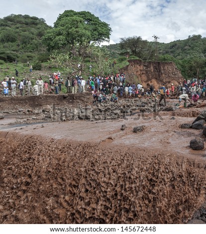 MANYARA, TANZANIA - NOVEMBER 28: The catastrophic debris flow destroyed a road between national parks Manyara and Ngorongoro. Car traffic was restored on the same day, on November 28, 2011 in Manyara