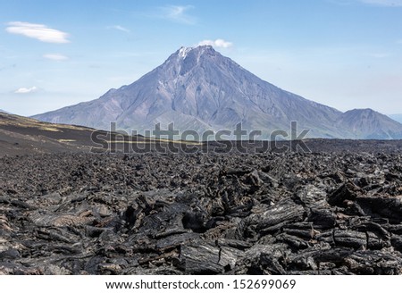 The Active Lava Flow From A New Crater On The Slopes Of Volcanoes Tolbachik, On Background Volcano Bolshaya Udina - Kamchatka, Russia