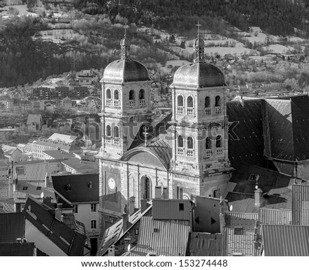 View on the Cathedral Briancon of an ancient fortress on the hill - France (black and white)