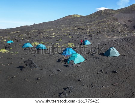 Base volcanologists and tourists near volcano Tolbachik - Kamchatka, Russia