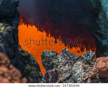 The boiling magma flows through lava tubes under a layer of cooled lava - volcano Tolbachik, Kamchatka, Russia