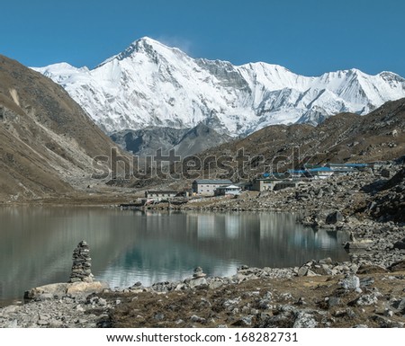 The view from the shores of the third lake in the village Gokyo and one of the highest peaks of the world Cho Oyu (8201 m) - Nepal, Himalayas