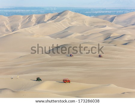 Tourists Travel Through The Dunes In The Atacama Desert - Oasis Of Huacachina, Peru, South America