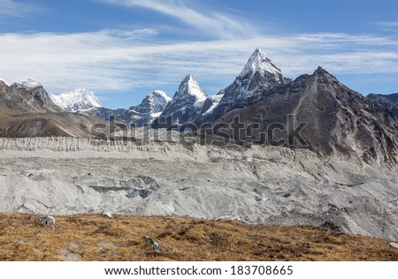 Gokyo glacier with mounts Everest, Nuptse, Nirekha, Kangchung, and Chola in background in the area of Cho Oyu - Gokyo region, Nepal, Himalayas
