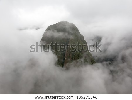 Inca city Machu Picchu in mist weather. It is a designated UNESCO World Heritage Site - Peru, South America (black and white)