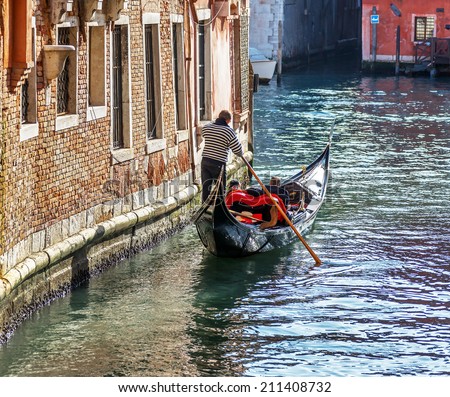 Ancient gondola is the main means of transportation of tourists in Venice - Italy