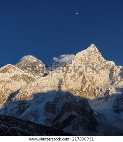 The Moon, Mt. Everest (8848 m), and Nuptse (7864 m) in the evening. View from Kala Patthar (5600 m) - Nepal, Himalayas