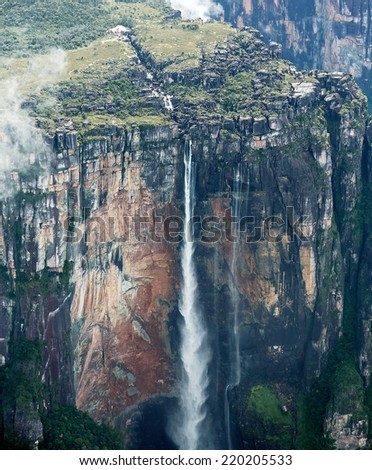 Angel Falls (top parts) is worlds highest waterfalls (978 m). View from an airplane - Venezuela, Latin America
