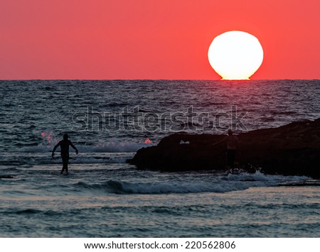 The sun goes down in the water of the Mediterranean sea - Israel