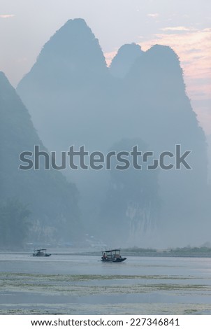 Misty morning on the river at sunrise - The Li River, Xingping, China
