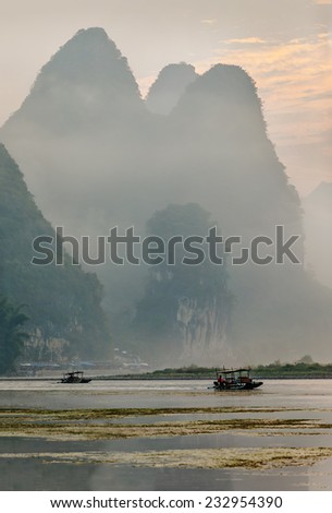 Misty morning on the river at sunrise - The Li River, Xingping, China