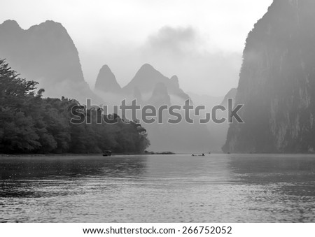 Foggy morning on the river at sunrise - The Li River, Xingping, China