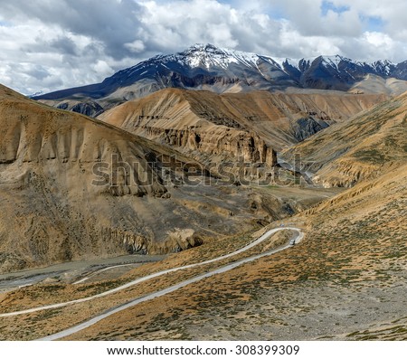 The road (Leh - Manali highway) is serpentine descent to the Pang village - Tibet, Leh district, Ladakh, Himalayas, Jammu and Kashmir, Northern India